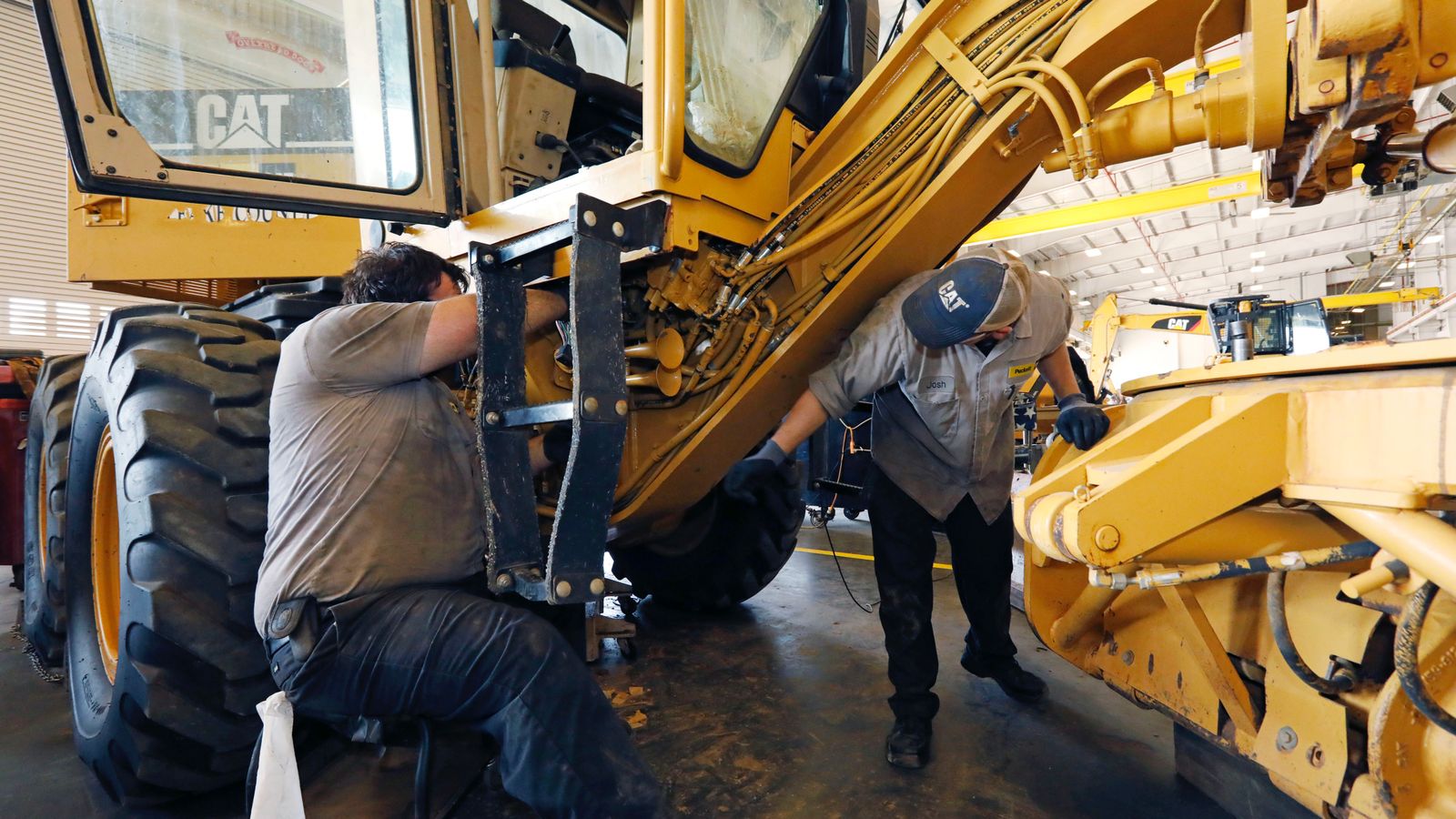 UAW tells Caterpillar workers it will not distribute full contract at