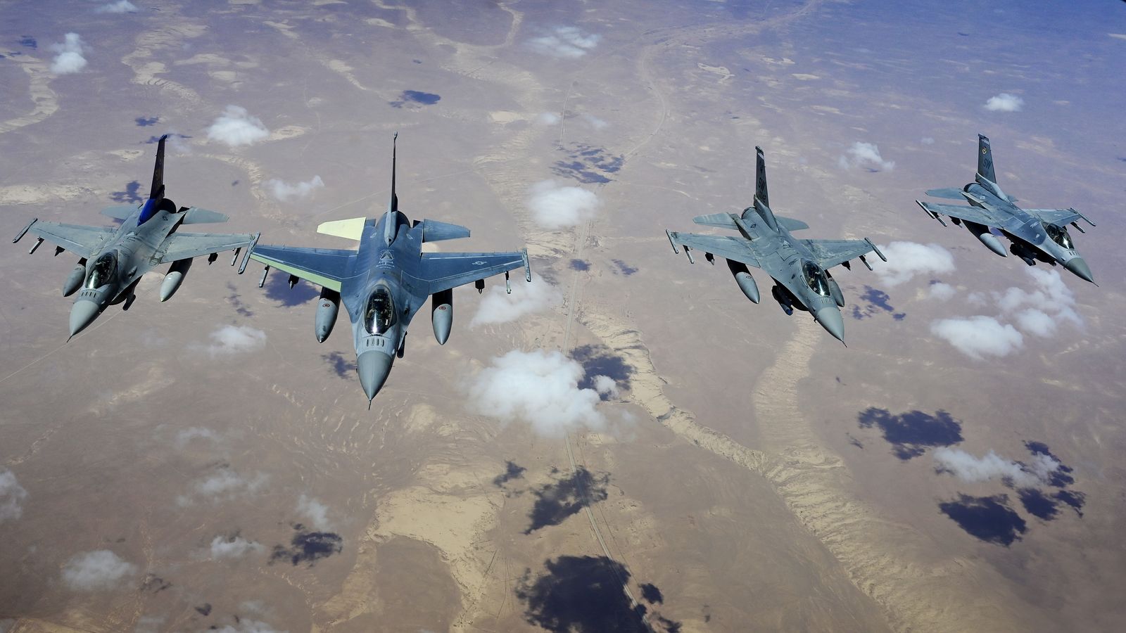 F-16 Fighting Falcons fly overhead during the New York Jets